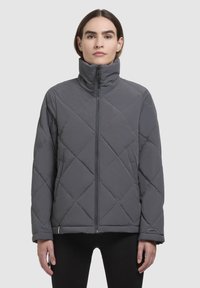 Gray quilted puffer jacket with a high collar, front zipper, and diamond pattern. Fabric appears smooth and insulated, suitable for colder weather.