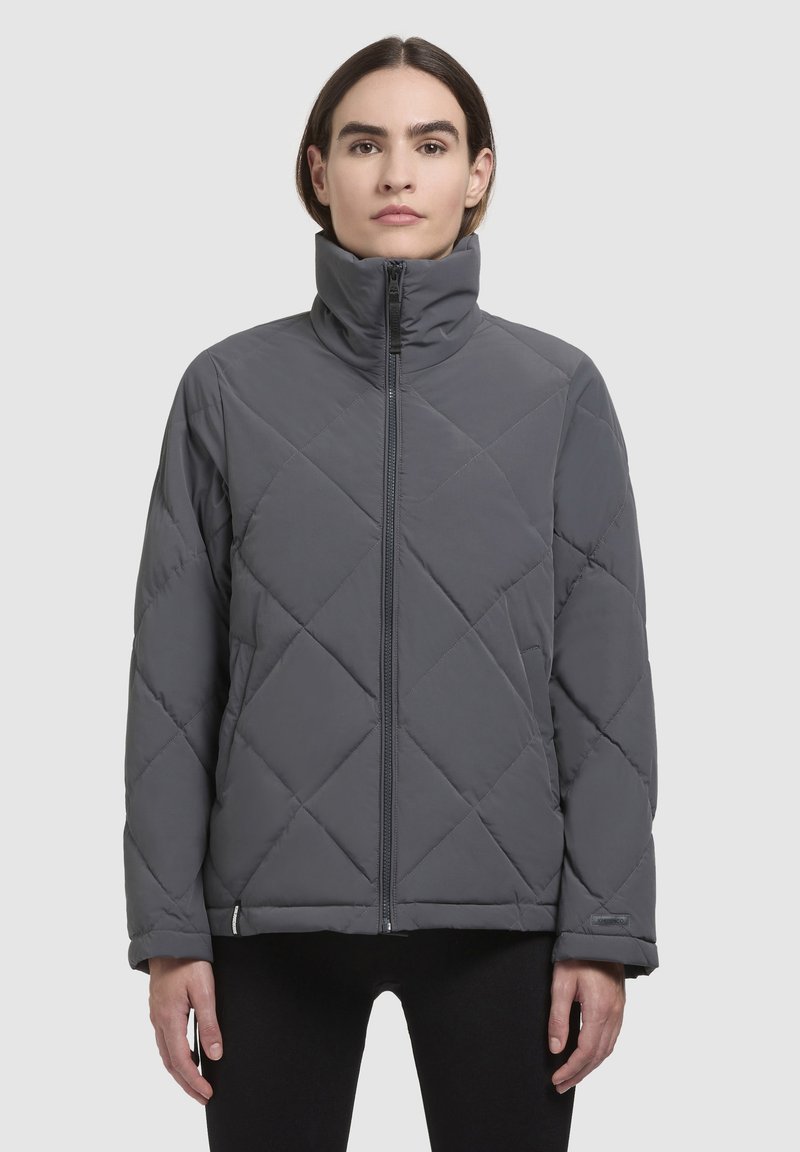 Gray quilted puffer jacket with a high collar, front zipper, and diamond pattern. Fabric appears smooth and insulated, suitable for colder weather.