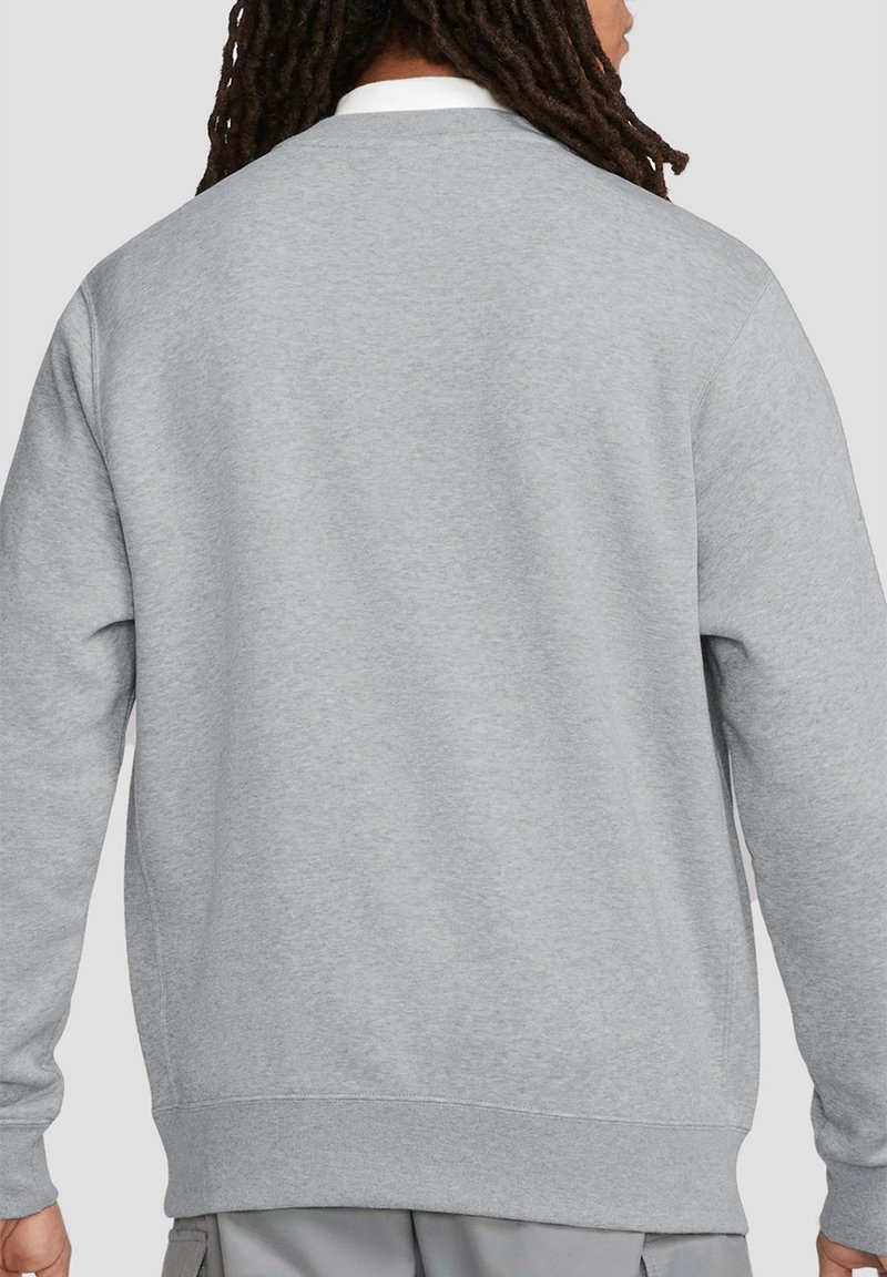 Gray sweatshirt made of soft fabric. Features a crew neck, ribbed cuffs, and hem. Plain back with no patterns or visible hardware.