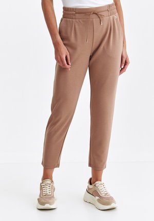 - Spodnie materiałowe