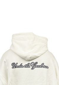White hoodie featuring a large hood, with the text "Under the Great Sun" in contrasting black, pixelated font across the back.