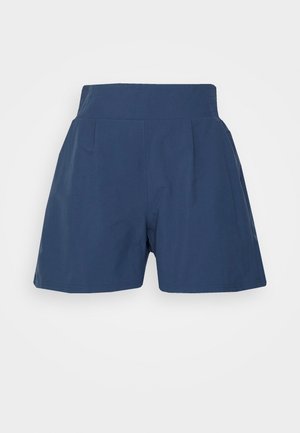 Marineblauwe shorts met hoge taille, brede tailleband en subtiele plooien aan de voorkant, weergegeven tegen een witte achtergrond.