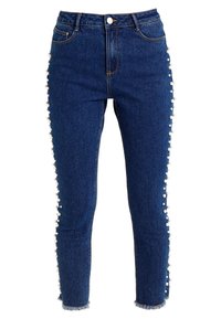 Högmidjade blå denimjeans med smal passform, som har vita pom-pom detaljer längs sidsömmarna och fransade fållar.