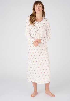 Camicia da notte leggera e a maniche lunghe color crema, caratterizzata da un motivo floreale colorato e un colletto arrotondato con chiusura a bottoni sul davanti.