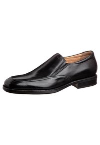 Black leather slip-on shoe with a smooth finish, rounded toe, subtle stitching details, and a low heel. Interior features a light tan lining.