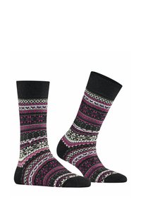 Sopraccalze lavorate a maglia con una base nera e vivaci motivi rosa, bianchi e grigi. I motivi includono righe, cuori e forme geometriche.