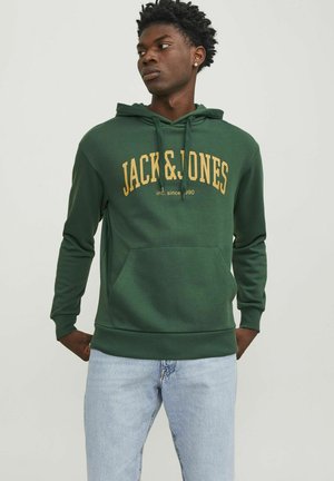 Green hoodie with a kangaroo pocket, drawstring hood, and yellow "JACK & JONES" logo print. Made from soft, textured fabric.