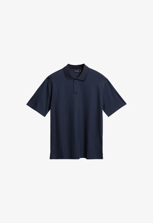 Marine blauwe polo met korte mouwen van zachte katoen. Voorzien van een klassieke kraag, een drie-knoopsluiting en zijsplitten voor meer bewegingsvrijheid.