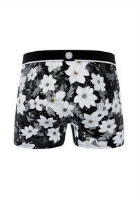 Caleçons noirs arborant un motif floral avec des fleurs blanches, des feuilles grises et des accents dorés. Taille noire avec un logo.