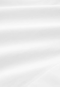 White fabric with a smooth, even texture, showing subtle curves and folds. The surface appears matte with no visible patterns or designs.