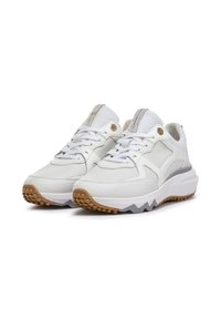 White athletic sneakers with mesh and synthetic upper, textured accents, padded collar, and a rubber outsole with a patterned grip.