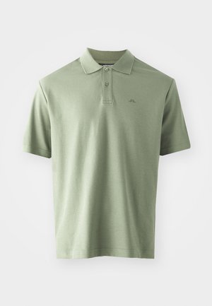Lys grøn polo t-skjorte laget av bomull, med en klassisk krage, tre knapper og korte ermer. Diskret logo trykket på brystet.