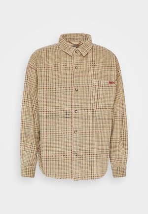 Shirt koos krae tan ruudulise kangaga, punaste aktsentidega, ees nupud ja vasakul rinnal tasku. Tekstuuriga, kerge materjal.