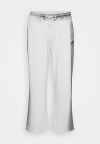 Grå bomullsblandings joggebukser med elastisk midje, snor og aksentpanel i en mørkere nyanse;. flared ben design.