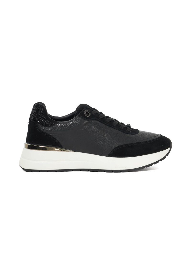 Black leather and suede sneaker with black laces, white thick sole, metallic gold heel accent, and small black decorative studs on the heel.