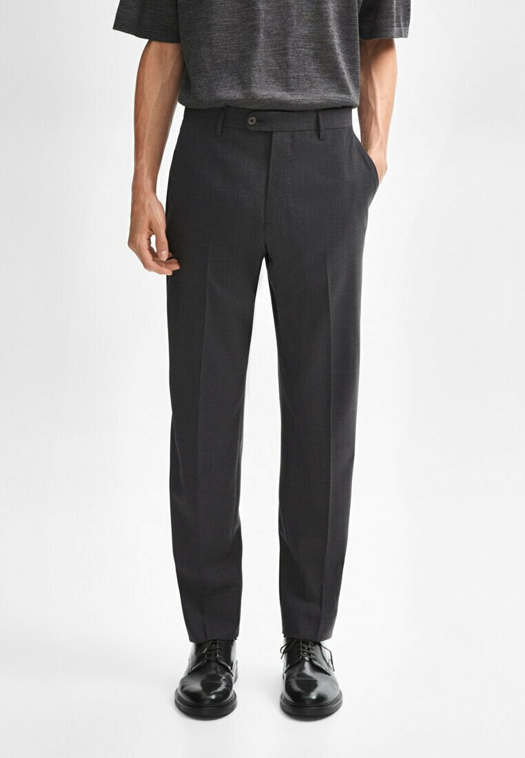 Dark grey tailored trousers made of textured fabric with a front crease, featuring a button closure and angled side pockets.