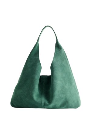 Green suede shoulder bag with a triangular shape, featuring a single handle and smooth texture, designed for versatility and spaciousness.