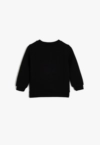 Czarna bawełniana bluza z ribbed strukturą, okrągłym dekoltem, długimi rękawami oraz dopasowanymi mankietami i dołem. Tylny widok ukazuje prosty design.