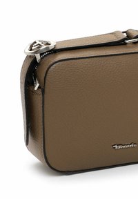 Brown leather handbag with a textured finish, rectangular shape, black trim, and a silver zipper pull featuring a round design.