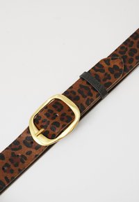 Leopard print leather belt featuring a gold rectangular buckle and a black leather keeper. Smooth texture with multiple adjustment holes.