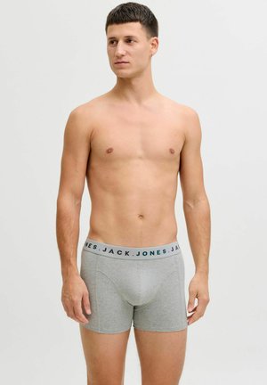 Sivi bokserici od mekog materijala, s plavim i bijelim brandingom na pojasu. Dizajn je jednostavan i prilagođen tijelu.