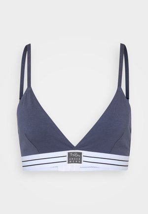 Marineblauwe bralette met een diepe V-hals, dunne bandjes en een witte gestreepte band met een logo. Glad materiaal met een minimalistisch ontwerp.