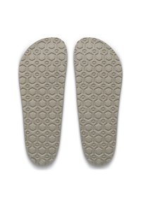 Γκρι πέλματα παπουτσιών με υφή κυψελών και στρογγυλεμένο σχήμα. Μέγεθος 42 σημειωμένο σε ένα πέλμα.