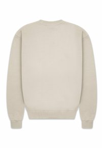 Beige collegepaita, jossa on ribbireunat kauluksessa ja hihansuissa. Pehmeä tekstuuri, pitkät hihat ja yksinkertainen muotoilu ilman kuvioita tai yksityiskohtia. Takakatsaus.