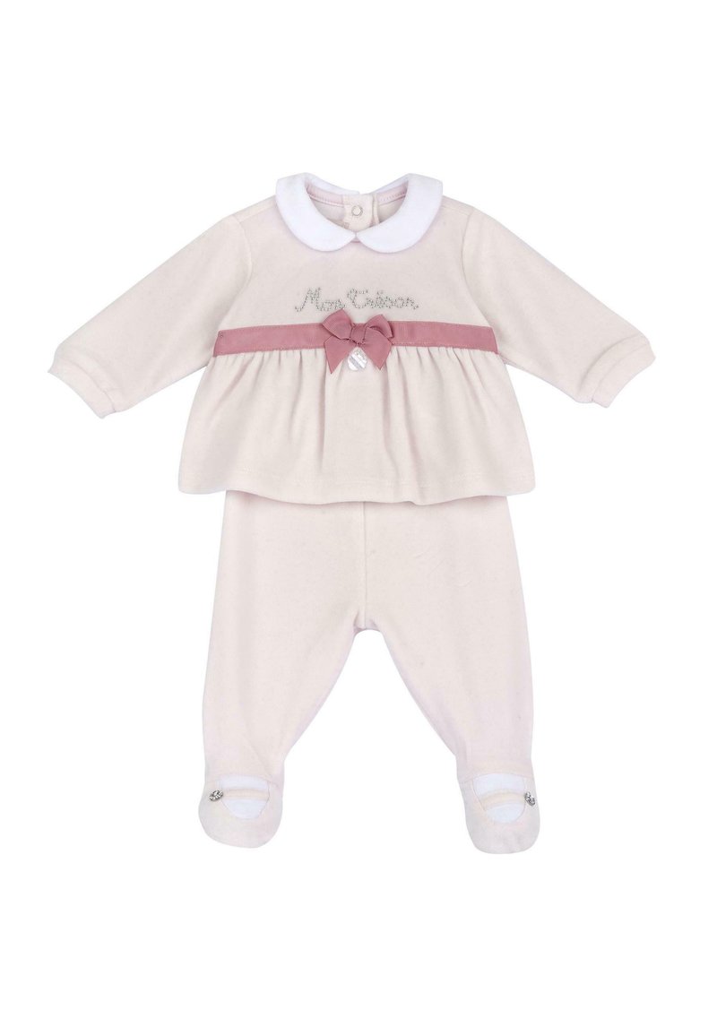 Krémový dětský outfit obsahující dlouhý rukáv top s bílým límcem, růžovými mašličkami a odpovídajícími kalhotami se špičkami.