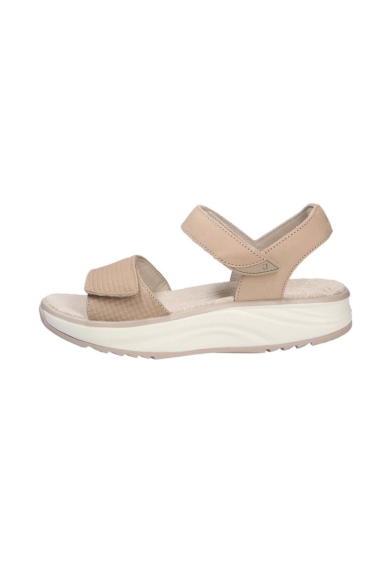 Sandalias beige con correas ajustables, zona de los dedos texturizada, plantilla suave y suela blanca gruesa con líneas onduladas.