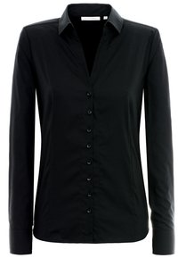Camicia nera a maniche lunghe con colletto a punta, realizzata in tessuto morbido, caratterizzata da una chiusura frontale con bottoni discreti e vestibilità slim.