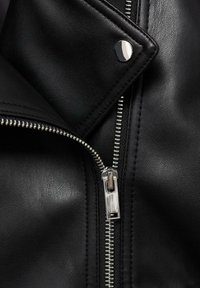 Black leather jacket featuring a diagonal zipper, silver hardware, and a textured finish. Snap closure detail visible near the collar.