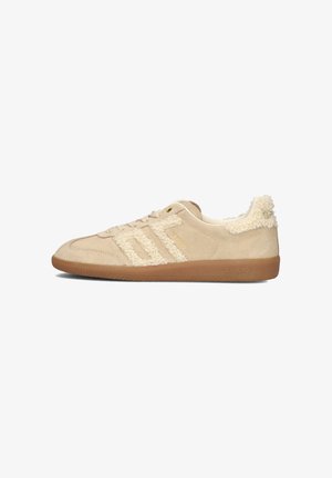 Beige suede sneaker with a textured cream fabric accent on the sides, lace-up design, and brown rubber sole. Branding on the heel.