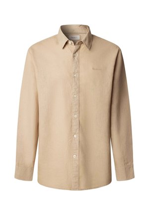 Smėlio spalvos ilgomis rankovėmis marškiniai su sagomis, apykakle, matomomis siūlėmis ir subtiliu logotipo išsiuvinėjimu kairėje krūtinės pusėje.
