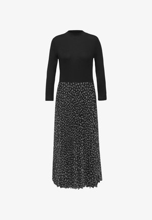 Langes schwarzes Kleid mit einem enganliegenden Oberteil und einem fließenden, gemusterten Rock mit hellgrauen abstrakten Formen auf schwarzem Grund.