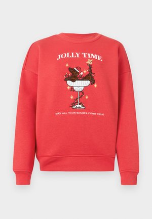 Czerwona bluza z kapturem z centralnym grafikiem psa w misce z czapką świętego Mikołaja i gwiazdkami. Tekst brzmi "WESOŁY CZAS" i "NIECH WSZYSTKIE TWOJE ŻYCZENIA SIĘ SPEŁNIĄ."