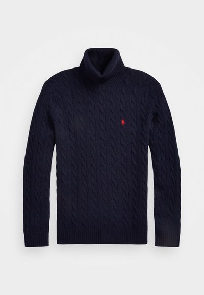 Tumed sinise värviga nöörkootud kõrge kaelusega kampsun paksust kangast, millel on rinnal väike punane logo ja soonikkoes varrukate ja allääre osad.