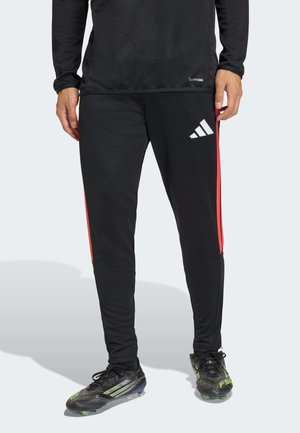 TRIO 26 LEAGUE SLIM - Tracksuit bottoms - black/semi lucid red