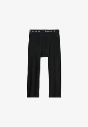 Sous-vêtements de performance noirs au design ajusté, dotés d'une douce taille élastique portant la marque "Smartwool" et d'une poche avant.