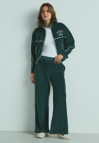 Next JOGGERS - Treniņtērpa apakšdaļas - green