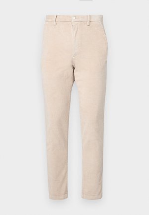 Beige corduroy pants with a straight leg design, featuring a button closure, belt loops, and subtle ribbed texture.