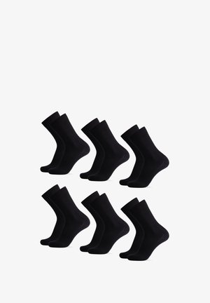Six paires de chaussettes en coton noir avec un poignet côtelé et une texture lisse, présentant un design classique de longueur crew.