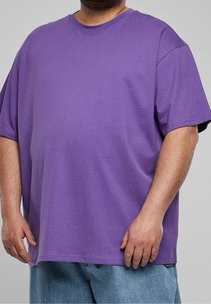 Purple short-sleeve t-shirt made of soft cotton. Loose fit with a round neckline and straight hem, featuring no visible design elements.