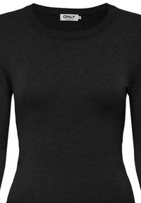 Suéter negro de manga larga con escote redondo. Fabricado en un tejido de punto suave, presenta una forma ajustada y un diseño minimalista sin adornos.