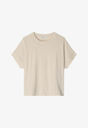 T-shirt beige à manches courtes, col rond, en tissu subtilement texturé avec un design de revers plié aux manches.