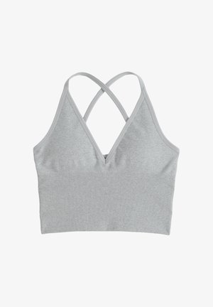 Szara sportowa bielizna braletka wykonana z miękkiej, teksturowanej bawełny. Posiada dekolt w serek i krzyżujące się ramiączka z tyłu dla wsparcia.