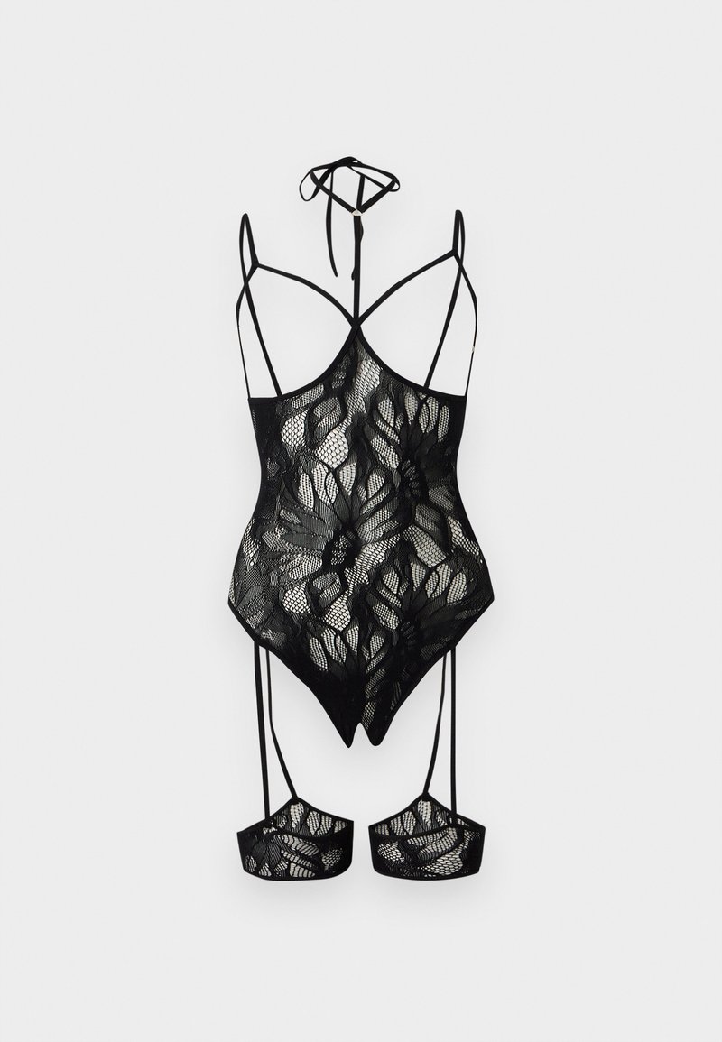 Body en dentelle noire avec motifs floraux, fines bretelles, lien autour du cou style halter et jarretelles attachées avec poignets en dentelle assortis.