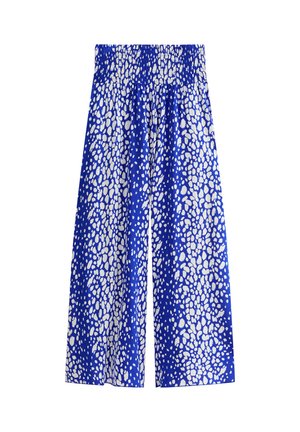 Weite Hose mit blau-weißem, unregelmäßigen Punktmuster und einem hohen, gerafften elastischen Bund.