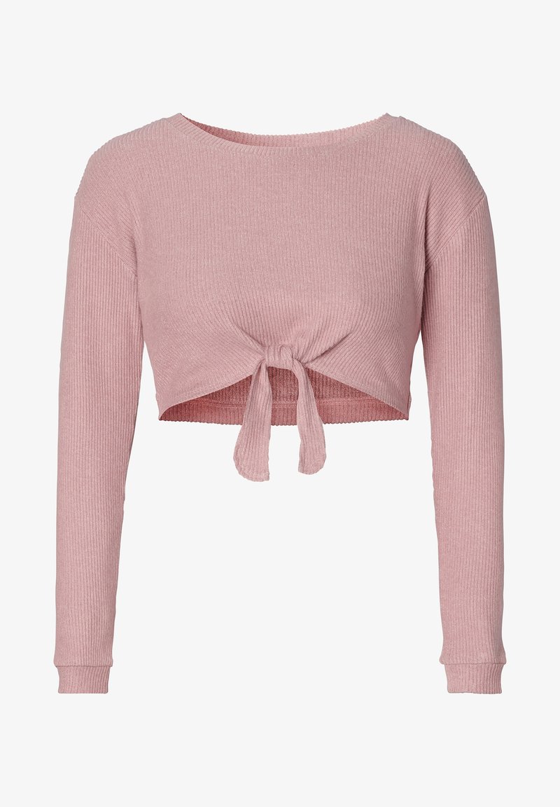 Top court côtelé rose avec manches longues et devant noué. Le tissu a une texture douce, mettant en valeur la coupe ajustée.