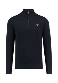 Dunkelblauer Pullover mit langen Ärmeln, hohem Kragen, halber Reißverschluss, strukturiertem Stoff und kleinem gesticktem Logo auf der Brust.